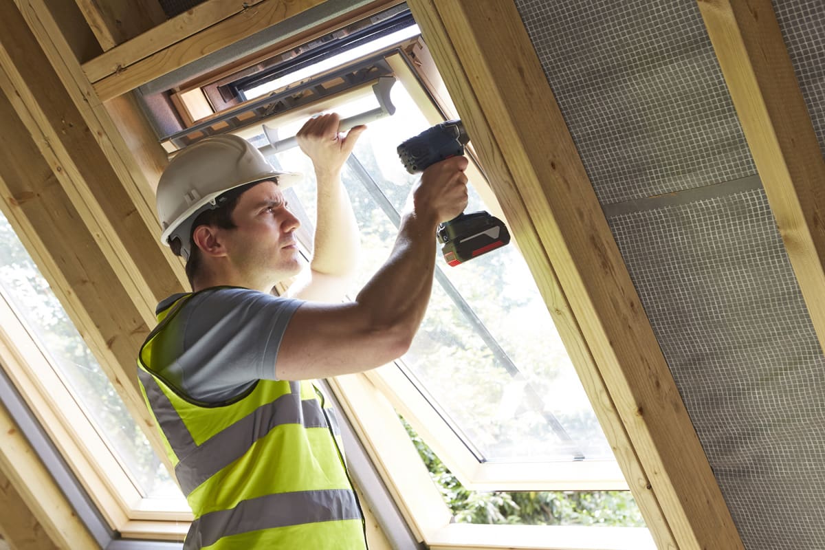 Carpenter Installing Velux Window