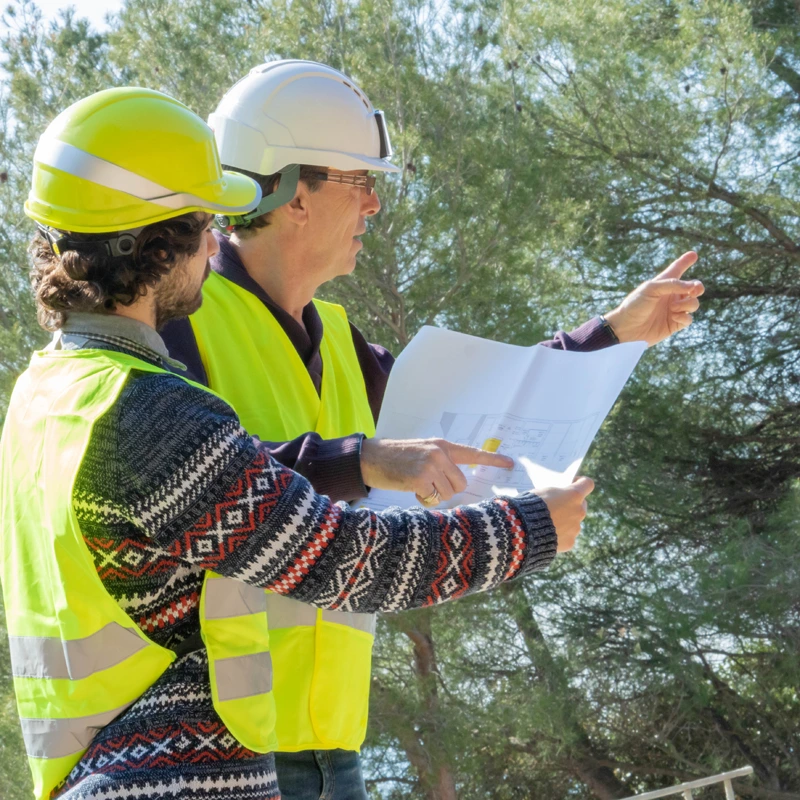 Construction Supervisor discussing work from plans